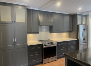 Custom grey shaker-style kitchen cabinets installed in Fergus, Ontario by Palmer’s Woodworking featuring full-height cabinetry, modern hardware, and stainless steel appliances.